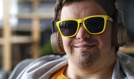 man with yellow glasses